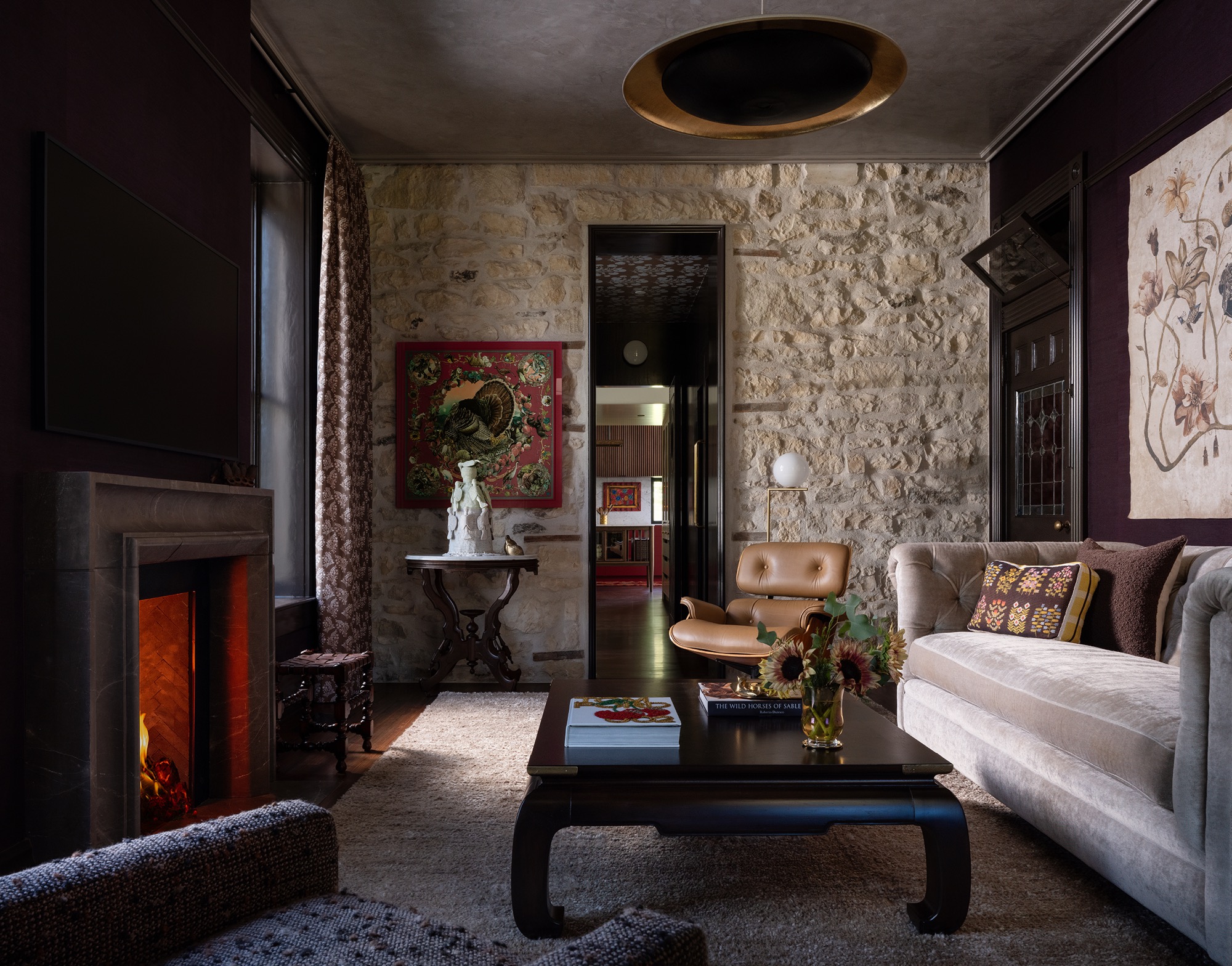 Victorian House den with stone wall and historic trim in Austin, Texas